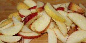 slices Baking Apple Pie Part 2: Cutting Out Flaws & Creating Pastry save money cut create variety amount flexible experiment preference different discovery taste damage bruise bite marks wild animals chop quarter core peel knife dry pieces strips thin thick bowl water brown recipe mix dough sugar butter margarine cheap electric stand mixer whisk eggs flour attachment sturdy hook refrigerate ball hour fridge easy pliable filling nutmeg cinnamon stir drain seeds skin