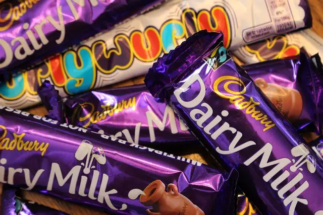 pile of cadbury dairy milk chocolate bars
