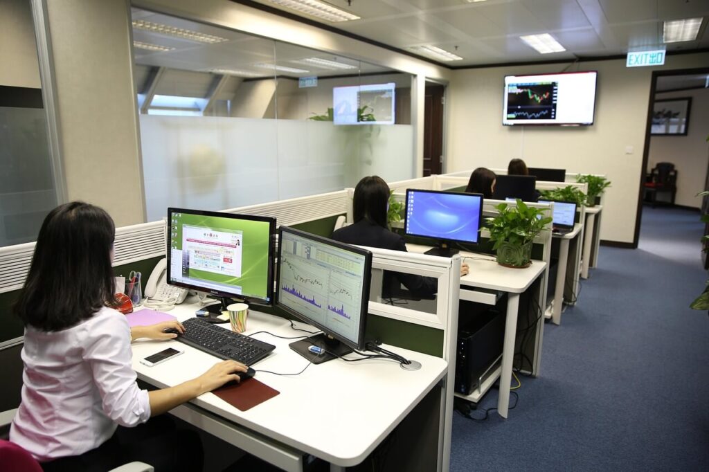 women in an office working on computers